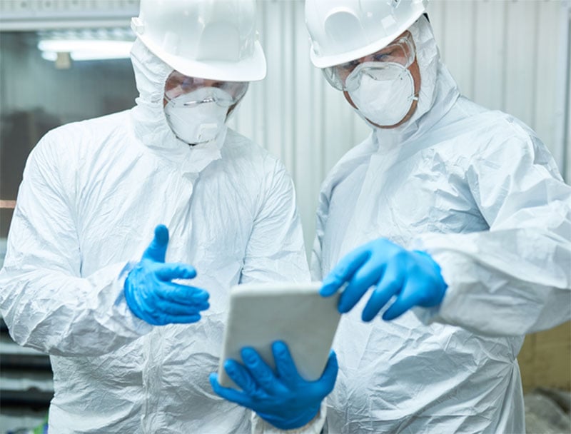 Two scientists in protective lab wear