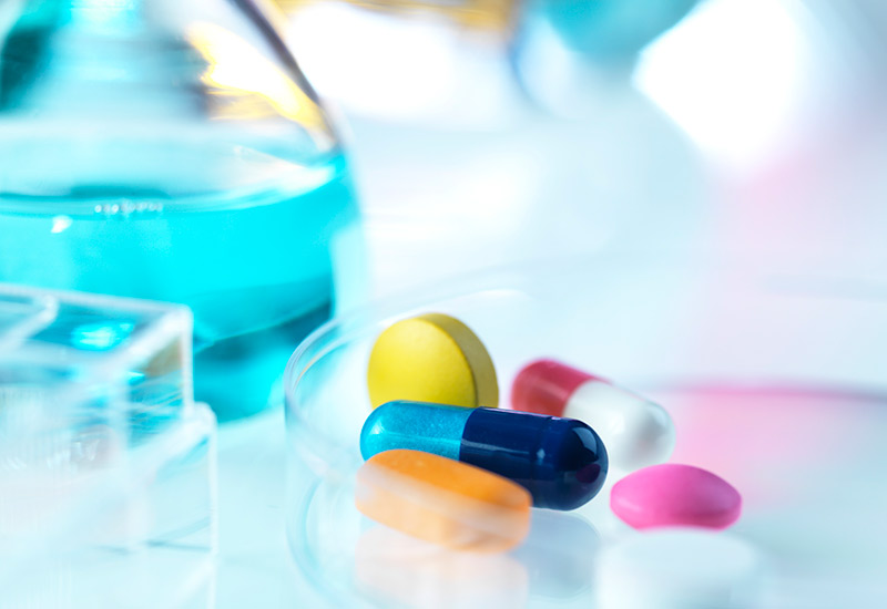 A brightly coloured photo of pharmaceutical tablets