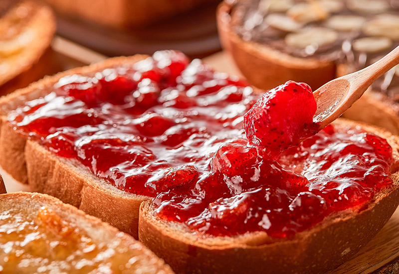 Fresh strawberry jam on wholemeal bread