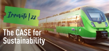 Green passenger train moving at high velocity speeds