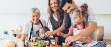Family preparing food in a kitchen